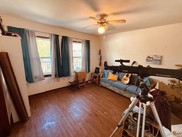 bedroom with wood finished floors and a ceiling fan