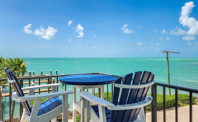 balcony featuring a water view