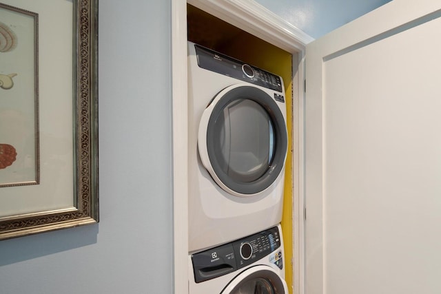 laundry area with stacked washer / dryer