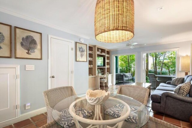 dining room featuring crown molding and ceiling fan