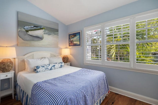 bedroom with dark wood-type flooring and vaulted ceiling