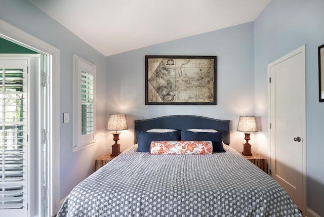 bedroom featuring vaulted ceiling