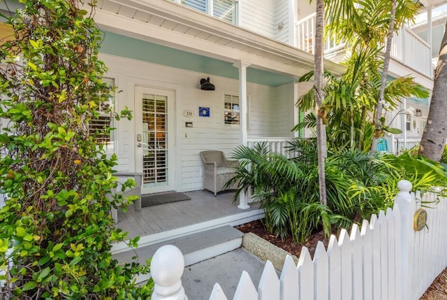 entrance to property featuring covered porch