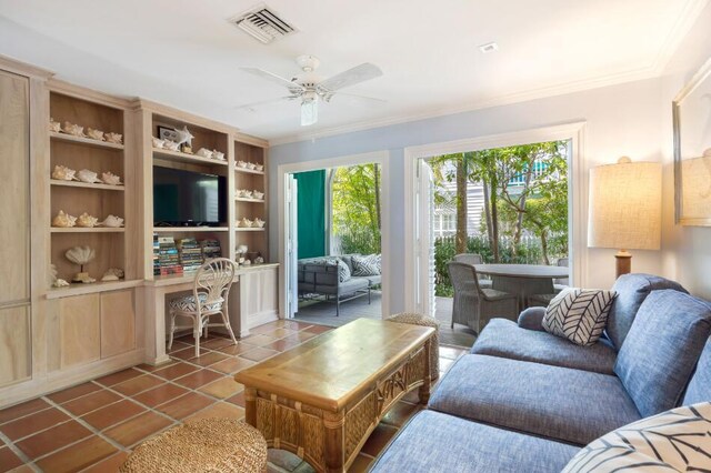 living room with crown molding, ceiling fan, tile patterned flooring, and built in features