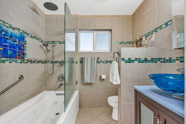 15 Garden Cove Dr, Key Largo, FL 33037 - bathroom featuring tile walls, tile patterned flooring, vanity, a combined bath / shower with rainfall shower, and toilet