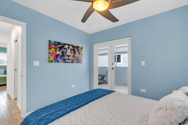15 Garden Cove Dr, Key Largo, FL 33037 - bedroom with light wood-style floors, a ceiling fan, french doors, and baseboards