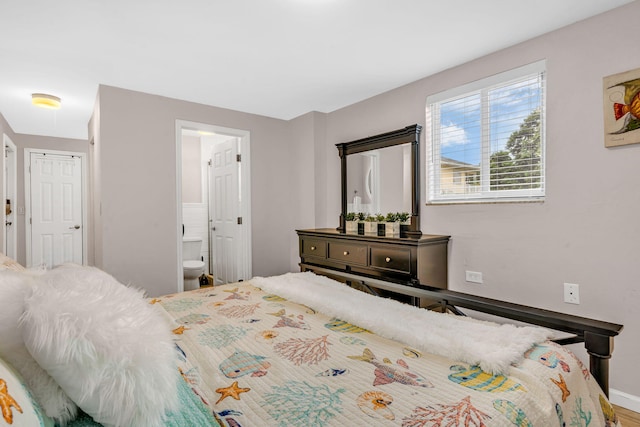 15 Garden Cove Dr, Key Largo, FL 33037 - bedroom featuring baseboards and ensuite bathroom