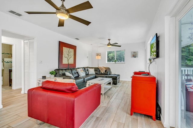 15 Garden Cove Dr, Key Largo, FL 33037 - living area featuring a ceiling fan, light wood finished floors, and baseboards