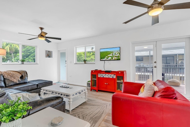 15 Garden Cove Dr, Key Largo, FL 33037 - living room featuring a ceiling fan, light wood-style floors, baseboards, and french doors