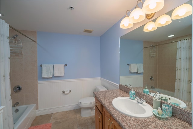 full bathroom with vanity, shower / tub combo, tile patterned flooring, and toilet