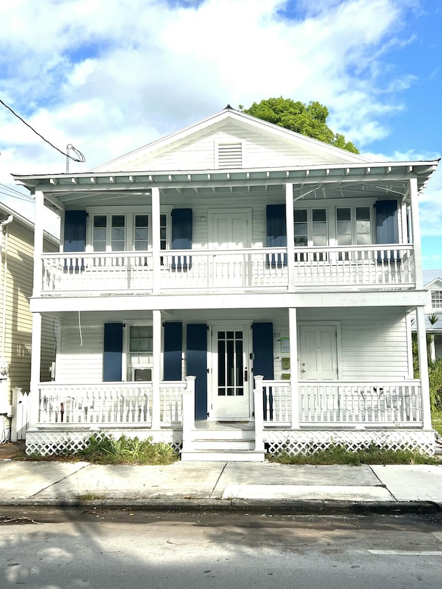 view of front facade featuring a balcony and covered porch