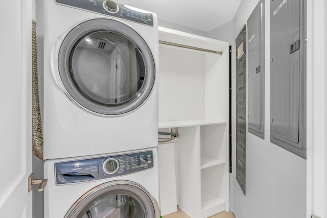 laundry room featuring stacked washing maching and dryer