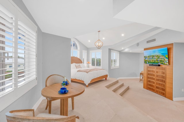 bedroom featuring vaulted ceiling and a notable chandelier