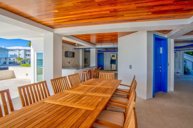 dining space featuring wood ceiling