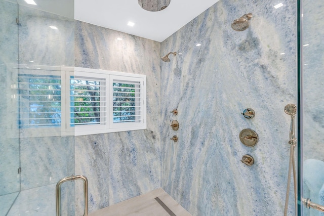 interior details featuring a tile shower