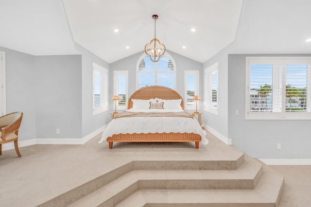 bedroom featuring vaulted ceiling and a notable chandelier