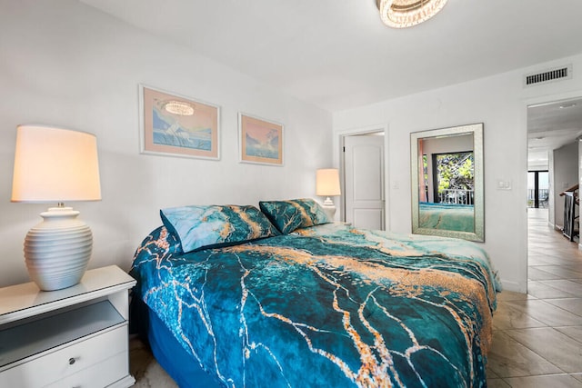 bedroom featuring light tile patterned floors