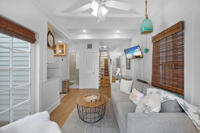 living room with recessed lighting, visible vents, a ceiling fan, stairway, and light wood finished floors