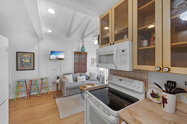 kitchen with white appliances, light wood-style flooring, glass insert cabinets, beam ceiling, and recessed lighting