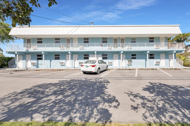 view of property with uncovered parking