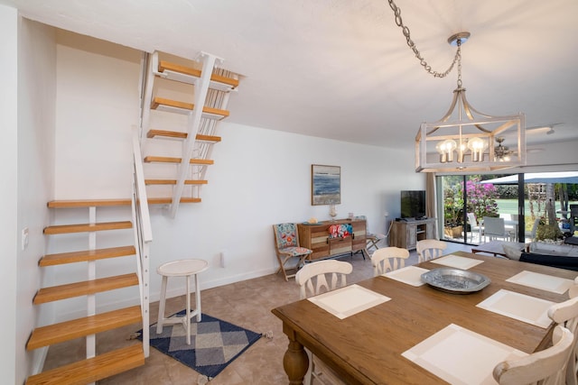 dining area with an inviting chandelier