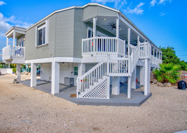 view of property exterior with ceiling fan and a patio