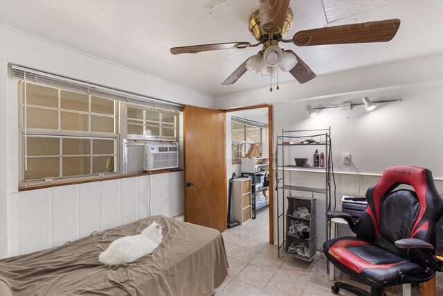 interior space with cooling unit and ceiling fan