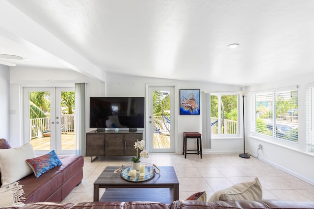 living room featuring light tile patterned floors and french doors