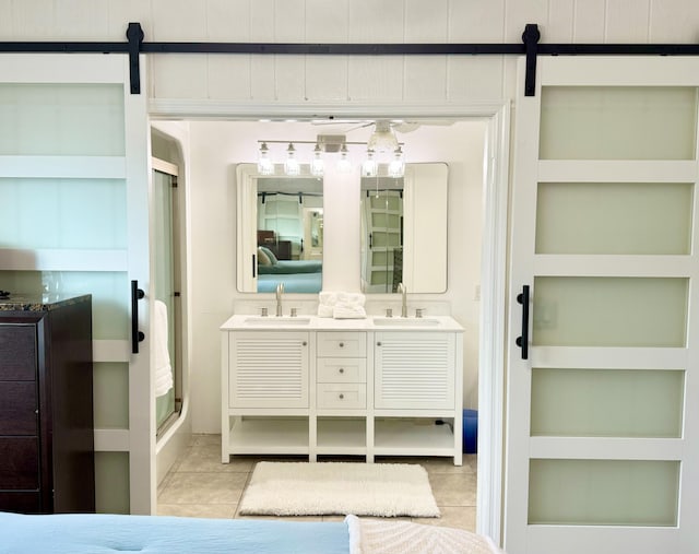 bathroom with vanity, tile patterned flooring, and built in shelves