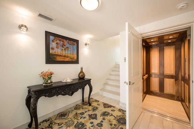 hallway with light hardwood / wood-style flooring