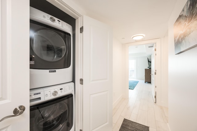 laundry room with stacked washer and dryer