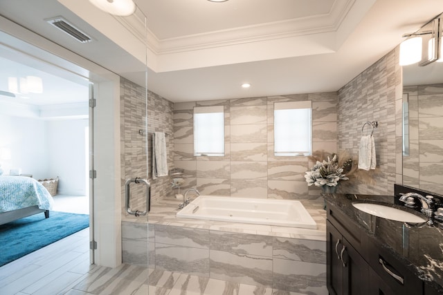 bathroom featuring crown molding, vanity, and tile walls