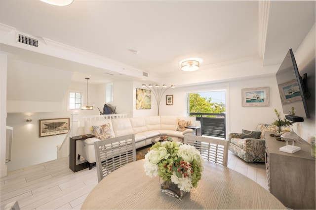 dining area featuring crown molding