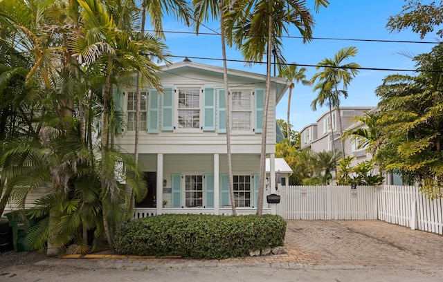 1025 Elgin Ln, Key West, FL 33040 - view of front facade with a gate, decorative driveway, and covered porch