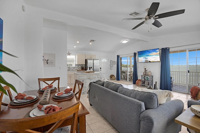 tiled living room featuring vaulted ceiling with beams and ceiling fan