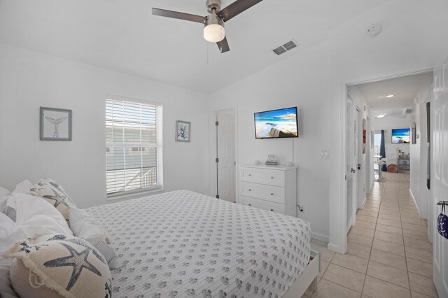 tiled bedroom with ceiling fan