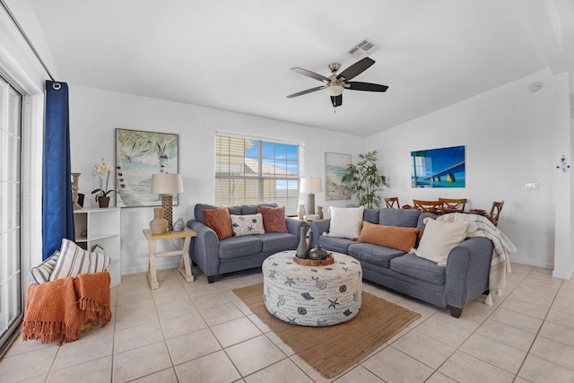 living room with ceiling fan and light tile patterned floors