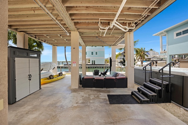 view of patio featuring outdoor lounge area and a water view