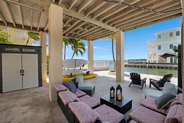 view of patio featuring an outdoor living space and a water view