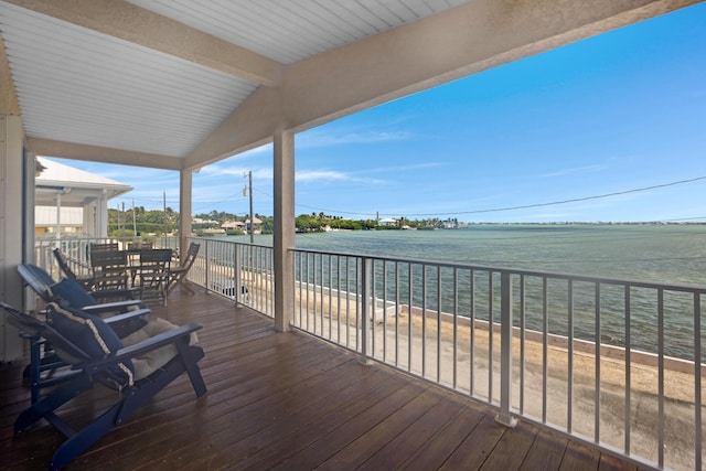 wooden deck featuring a water view