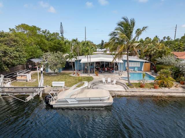 3608 Sunrise Dr, Key West, FL 33040 - view of dock with fence, boat lift, an outdoor pool, a patio area, and a water view
