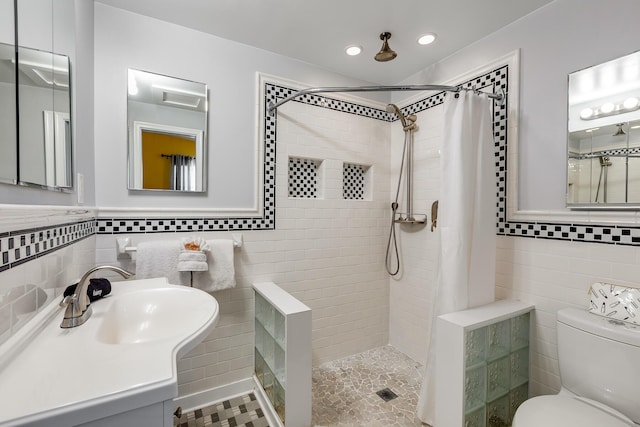 3608 Sunrise Dr, Key West, FL 33040 - bathroom featuring a tile shower, vanity, toilet, recessed lighting, and tile walls