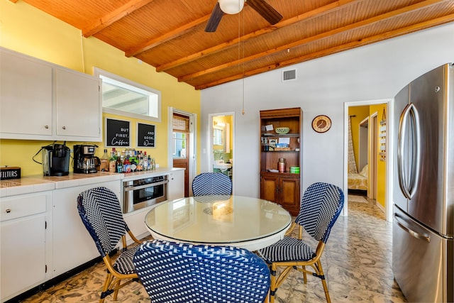 3608 Sunrise Dr, Key West, FL 33040 - dining area with beam ceiling, high vaulted ceiling, a ceiling fan, wooden ceiling, and visible vents
