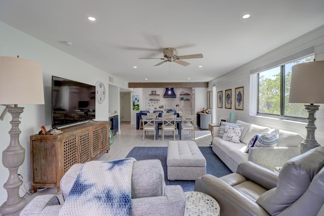 living area featuring a ceiling fan, recessed lighting, and light wood-type flooring