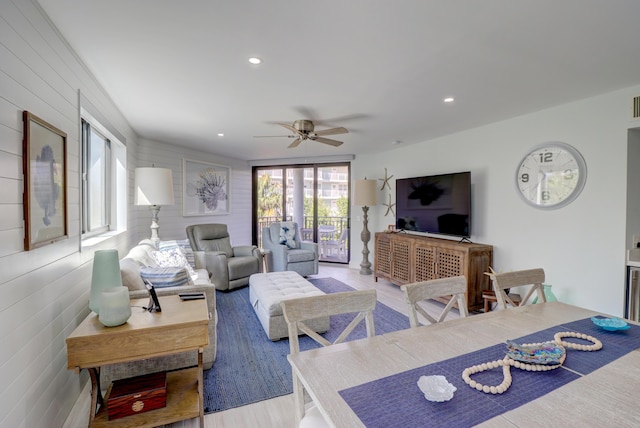 living room with recessed lighting, light wood-style floors, and ceiling fan