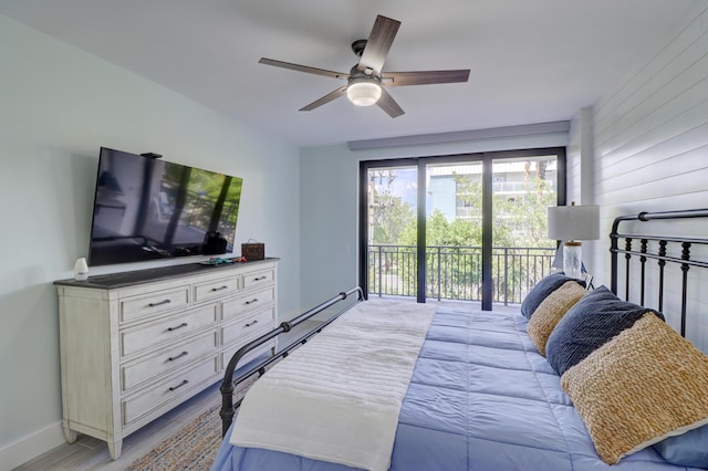 bedroom with baseboards, access to exterior, and a ceiling fan