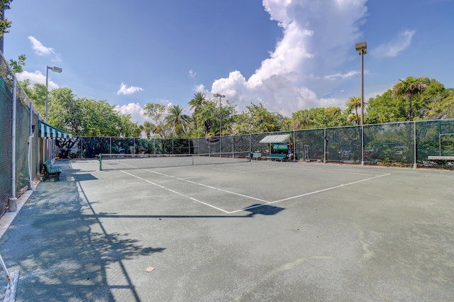 view of sport court with fence