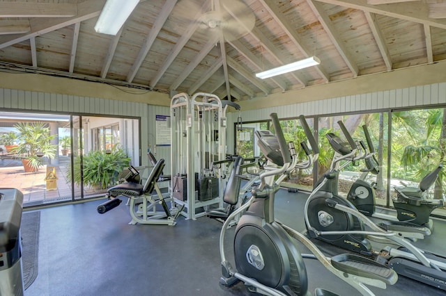 gym featuring lofted ceiling, wood ceiling, and a wealth of natural light