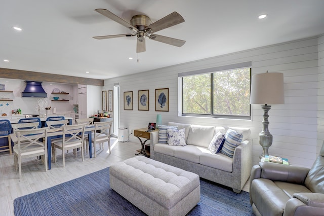 living area featuring a ceiling fan and recessed lighting