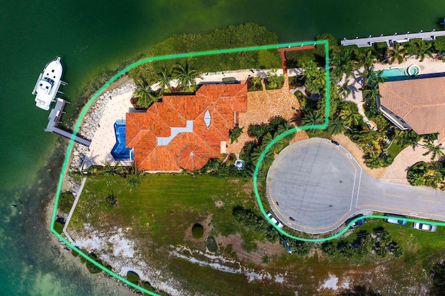 birds eye view of property featuring a water view